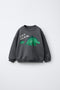 DINOSAUR PRINT SWEATSHIRT