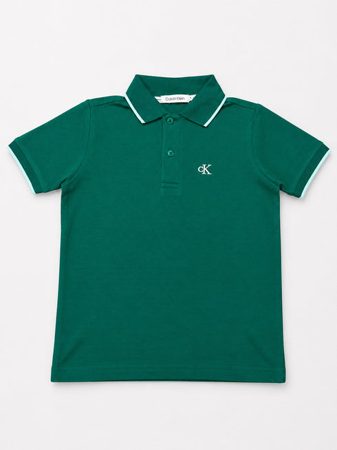 Emerald green polo shirt flat lay