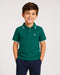 Emerald green polo shirt flat lay